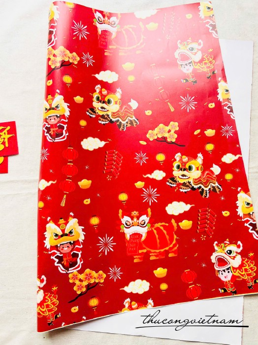 Giấy gói quà Tết 50*70cm- Họa tiết con lân